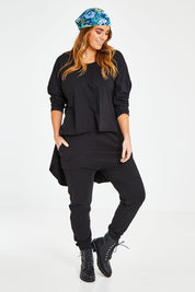 Model Laura wearing size 14 of the Easy Living Pants in colour Black (Black), from the front, showing the whole outfit