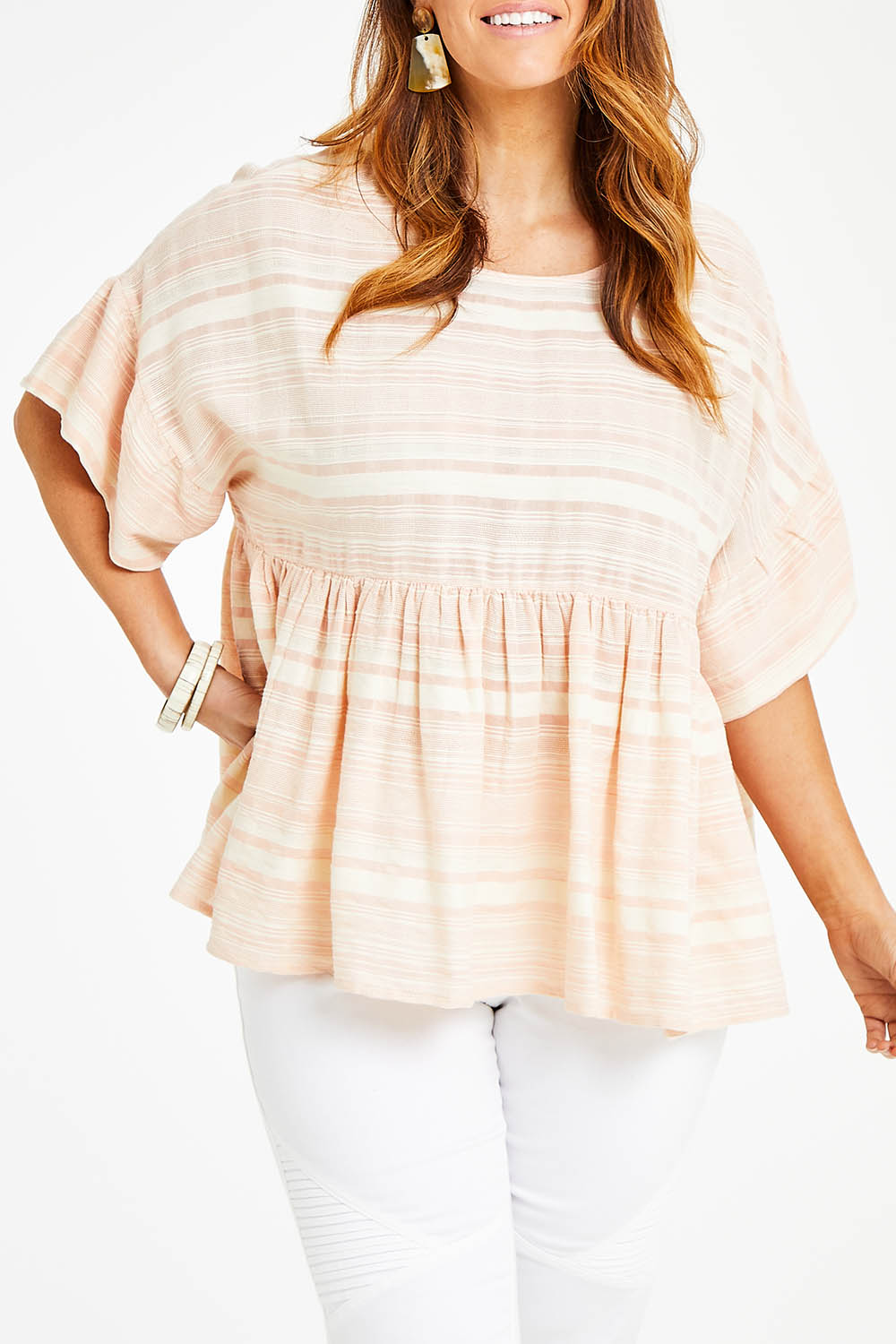 Model Laura wearing size 14 of the Perfect As You Are Stripe Top in colour Peach (Pink), from the front, cropped image