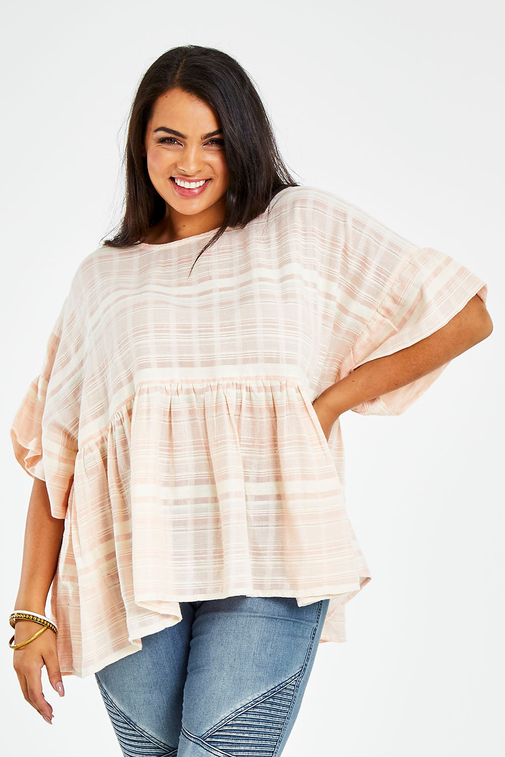 Model Sasha-Lee wearing size 16 of the Perfect As You Are Stripe Top in colour Peach (Pink), from the front, cropped image