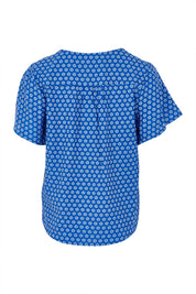 Product shot of the Cute As A Button Printed Blouse in colour Bluefleur (Blue), from the back