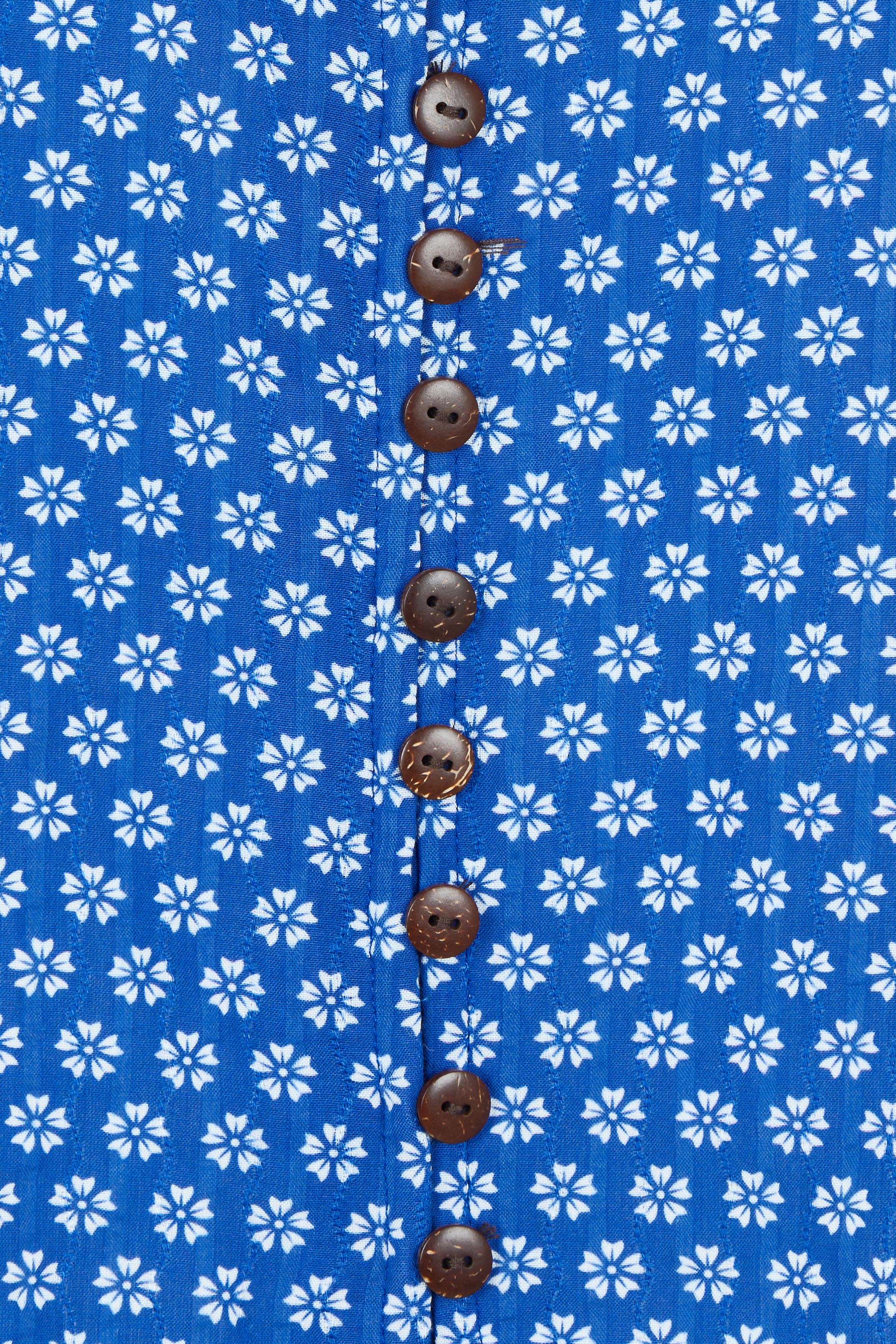 Product shot of the Cute As A Button Printed Blouse in colour Bluefleur (Blue), detail