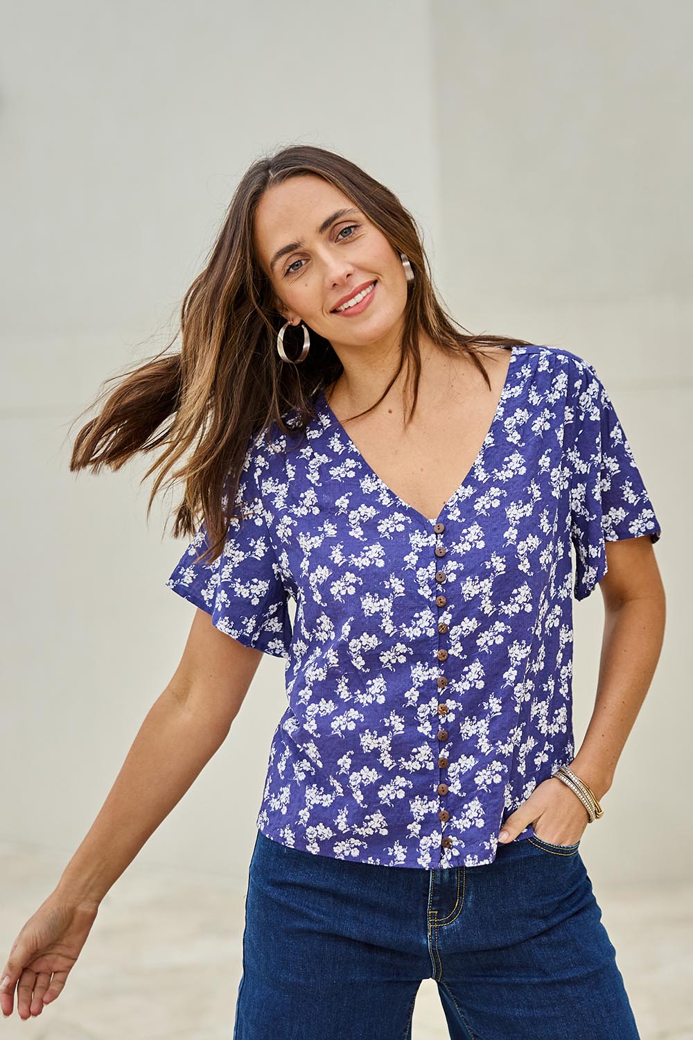 Model Tegand wearing size 10 of the Cute As A Button Printed Blouse - Blueposie in colour Blueposie, in a cropped view