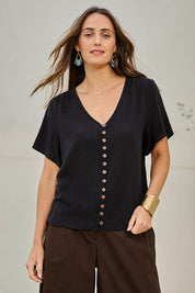 Model Tegand wearing size 10 of the Cute As A Button Cotton Blouse - Black in colour Black, in a cropped view