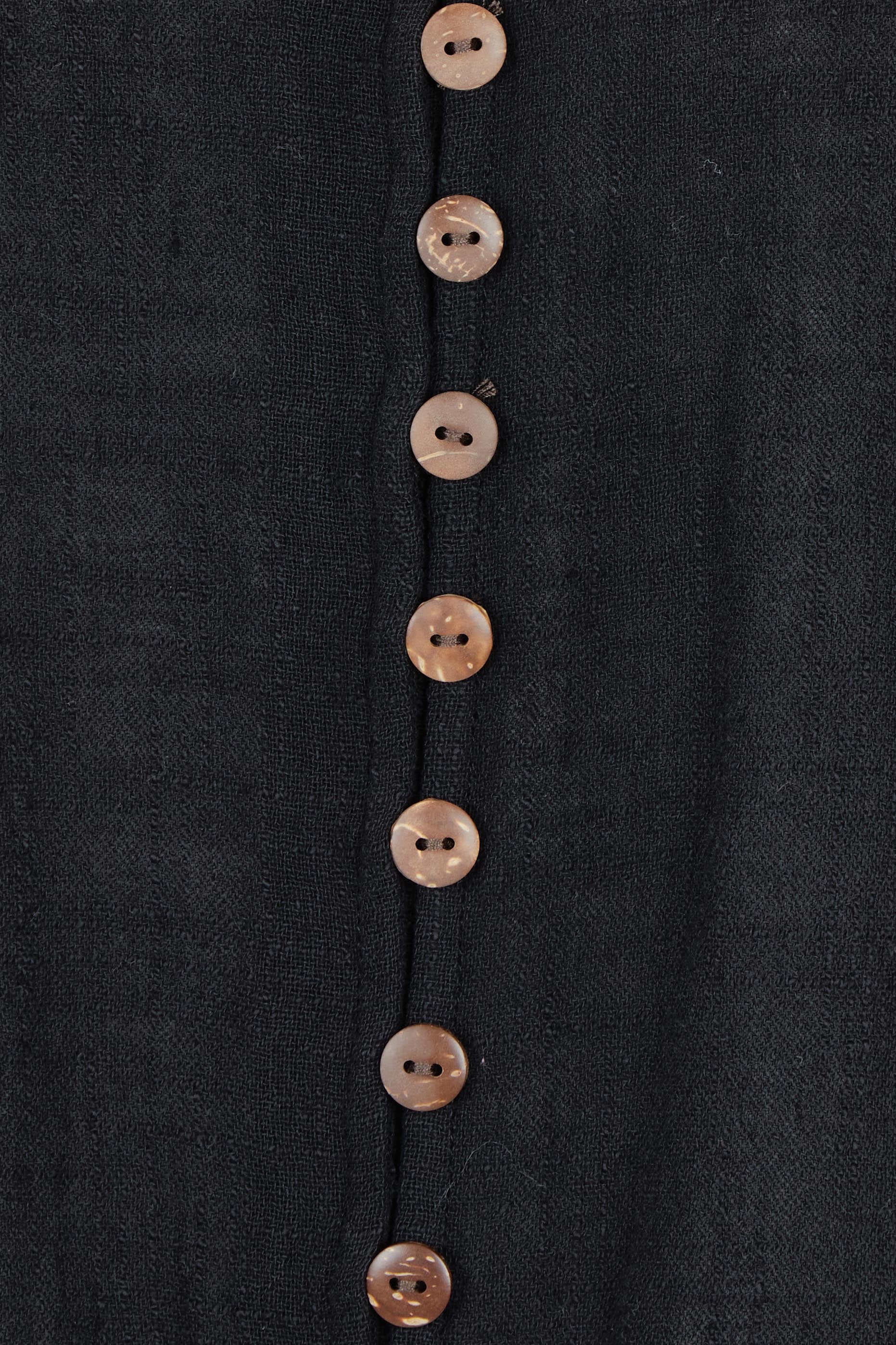 Product shot of the Cute As A Button Blouse in colour Black (Black), detail