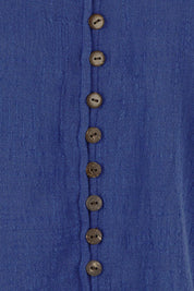 Product shot of the Cute As A Button Cotton Blouse - Blue in colour Blue, showing detail