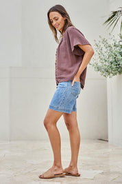 Model Tegand wearing size 10 of the Cute As A Button Blouse – Chocolate in colour Chocolate, from the front