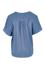 Product shot of the Cute As A Button Blouse – Denim in colour Denim, from the back