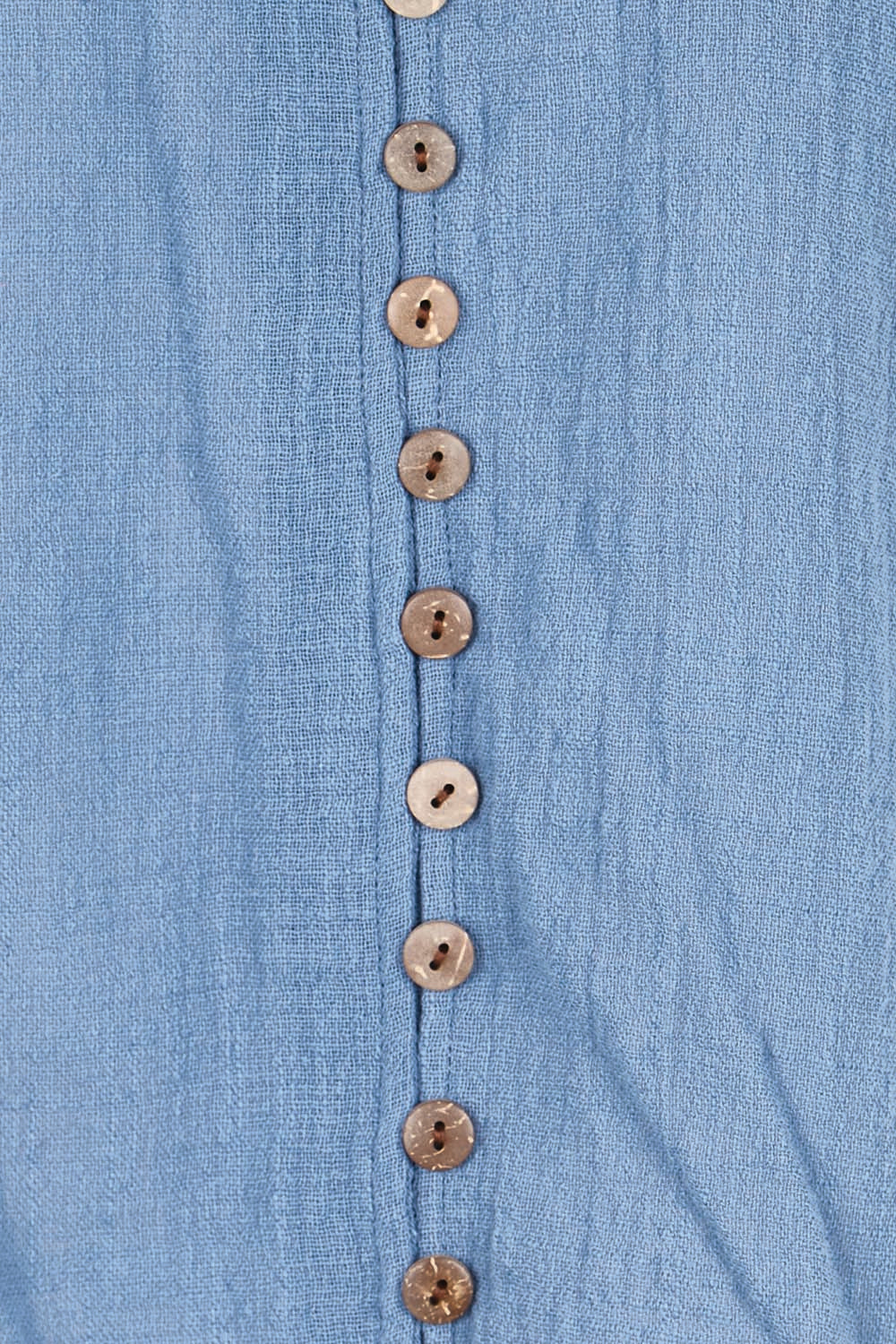 Product shot of the Cute As A Button Blouse – Denim in colour Denim, showing detail