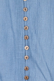 Product shot of the Cute As A Button Blouse – Denim in colour Denim, showing detail