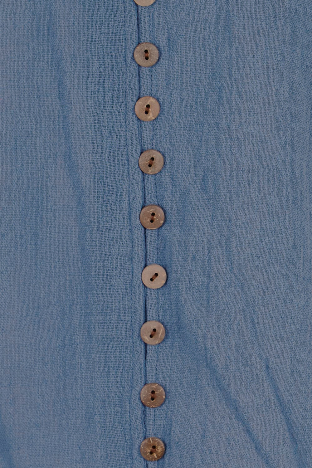 Product shot of the Cute As A Button Blouse – Denim in colour Denim, showing detail