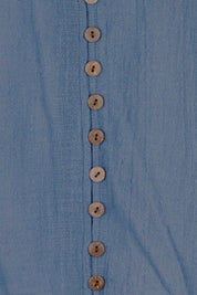 Product shot of the Cute As A Button Blouse – Denim in colour Denim, showing detail