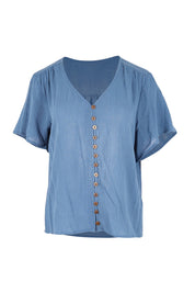 Product shot of the Cute As A Button Blouse – Denim in colour Denim, from the front
