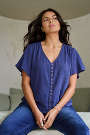 Model Tahnee wearing size 10 of the Cute As A Button Blouse in colour Frenchblue (Blue), from the front, showing the whole outfit