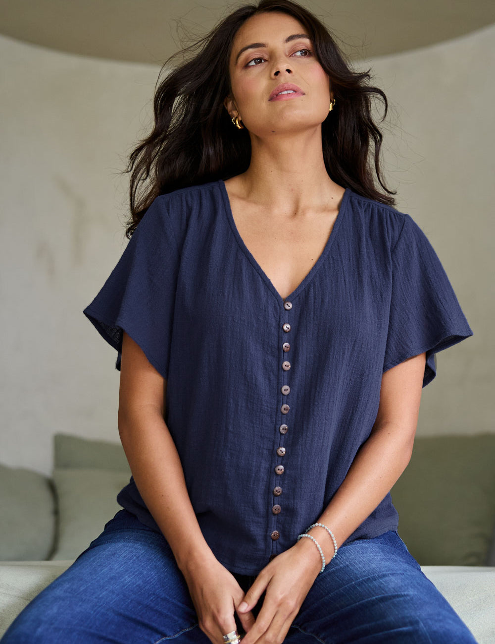 Model Tahneei wearing size 10 of the Cute As A Button Cotton Blouse - Frenchblue in colour Frenchblue, in a cropped view