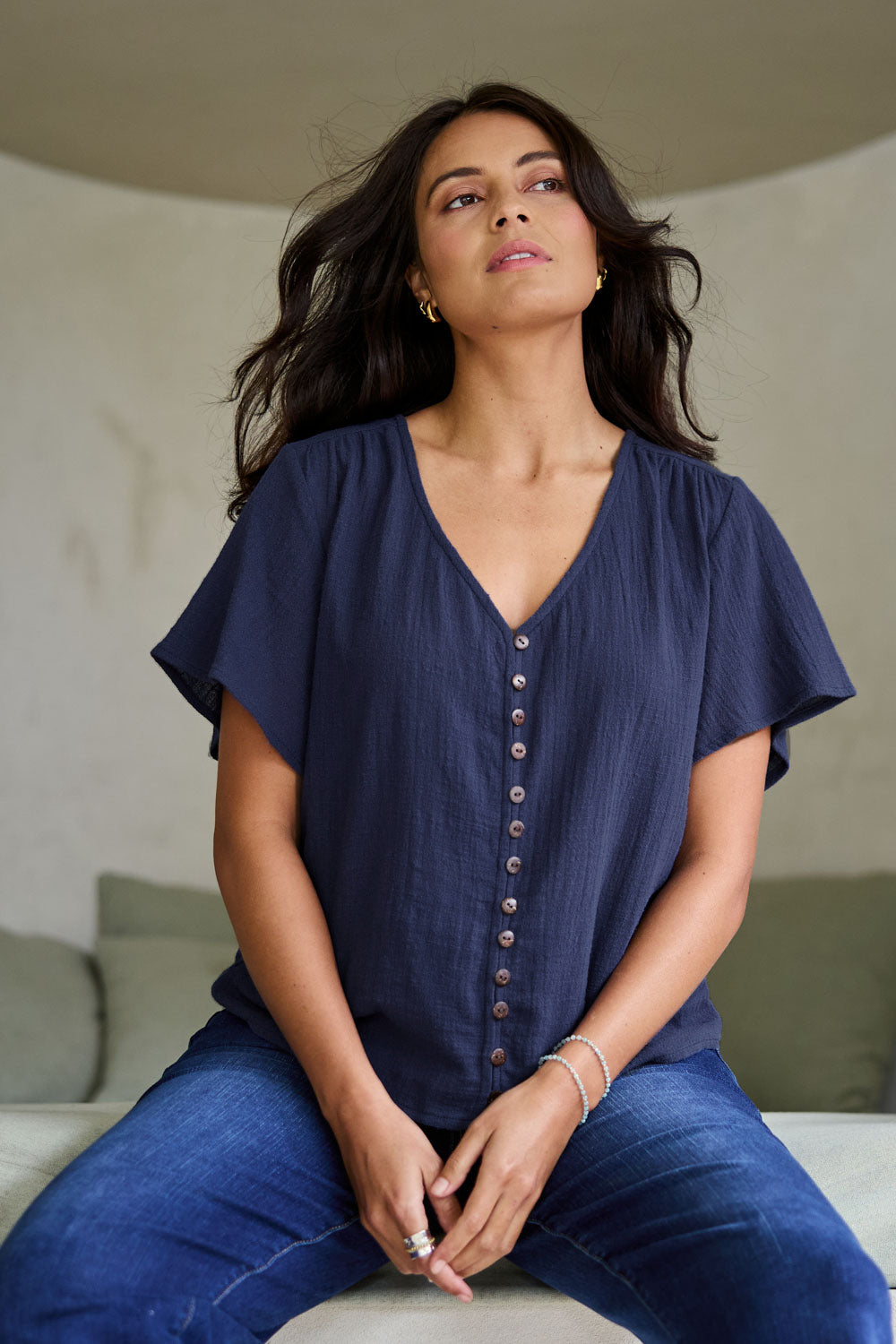 Model Tahneei wearing size 10 of the Cute As A Button Cotton Blouse - Frenchblue in colour Frenchblue, in a cropped view