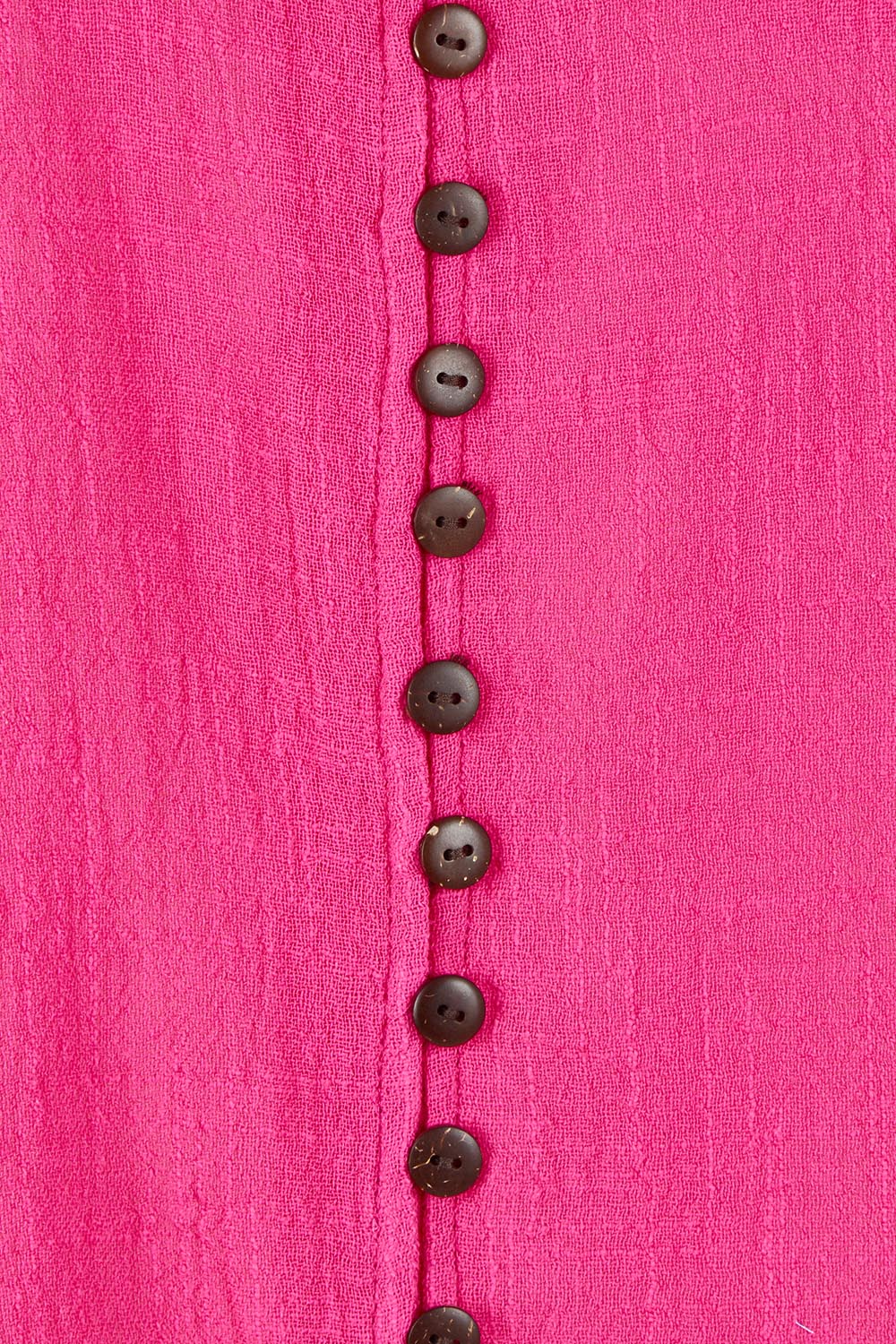 Product shot of the Cute As A Button Blouse in colour Hotpink (Pink), detail