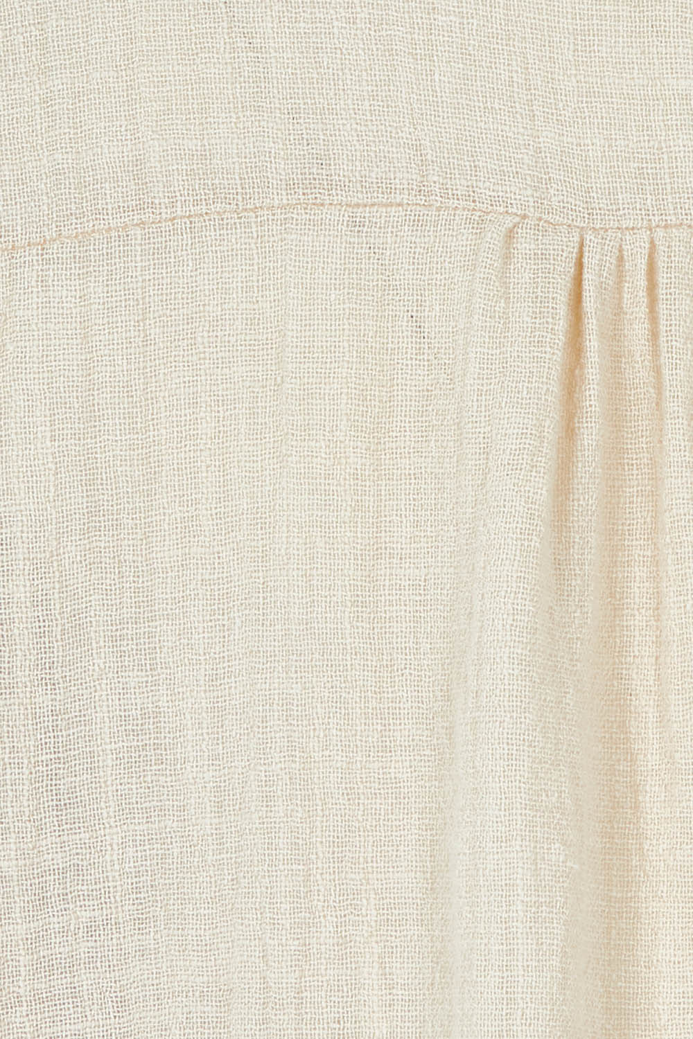 Product shot of the Cute As A Button Blouse in colour Natural, detail