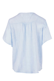 Product shot of the Cute As A Button Cotton Blouse - Sky in colour Sky, from the back