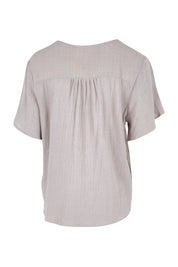 Product shot of the Cute As A Button Blouse – Smoke in colour Smoke, from the back