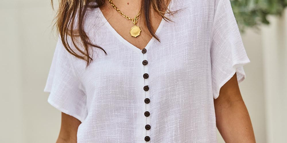 Model Tegand wearing size 10 of the Cute As A Button Blouse - White in colour White, in a cropped view