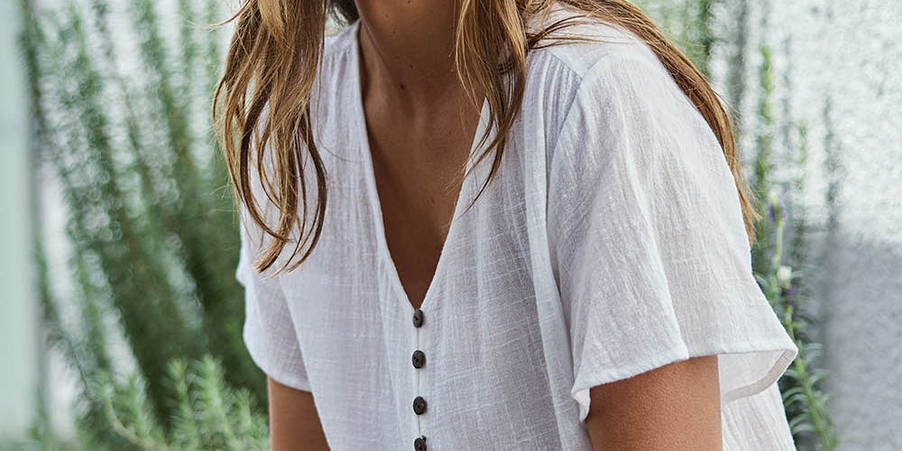 Model Tegand wearing size 10 of the Cute As A Button Cotton Blouse - White in colour White, in a cropped view