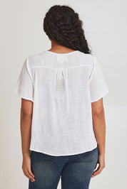 Model Terri-Leigh wearing size 14 of the Cute As A Button Blouse in colour White (White), from the back