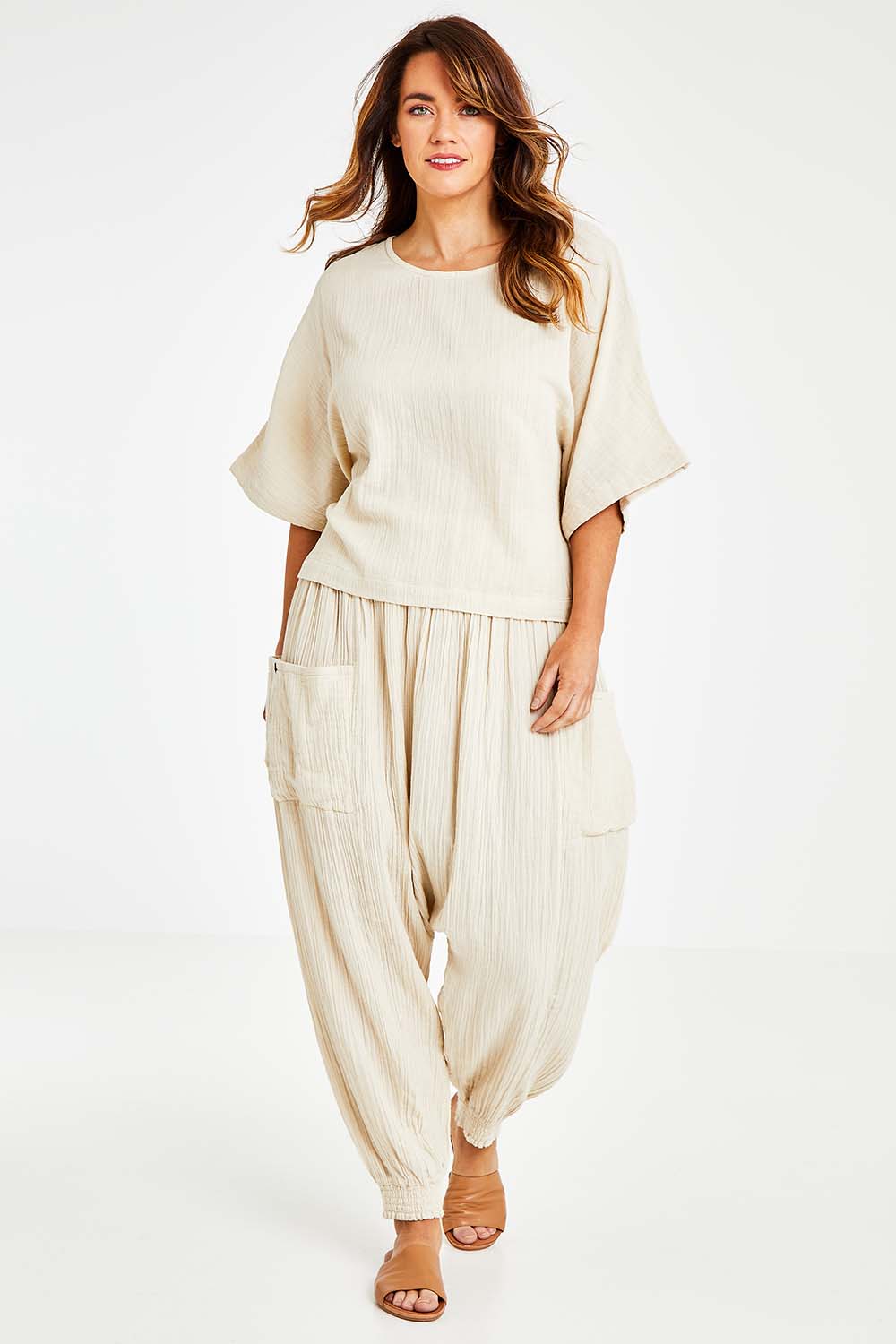Model Laura wearing size 14 of the Beach Breeze Cotton Top in colour Wheat, from the front, showing the whole outfit