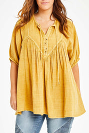 Model Laura wearing size 14 of the Daydreaming In Sunshine Blouse in colour Sunflower, from the front, cropped image