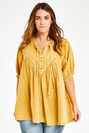 Model Laura wearing size 14 of the Daydreaming In Sunshine Blouse in colour Sunflower, from the front, cropped image