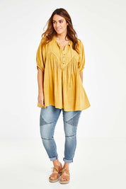 Model Laura wearing size 14 of the Daydreaming In Sunshine Blouse in colour Sunflower, from the front, showing the whole outfit