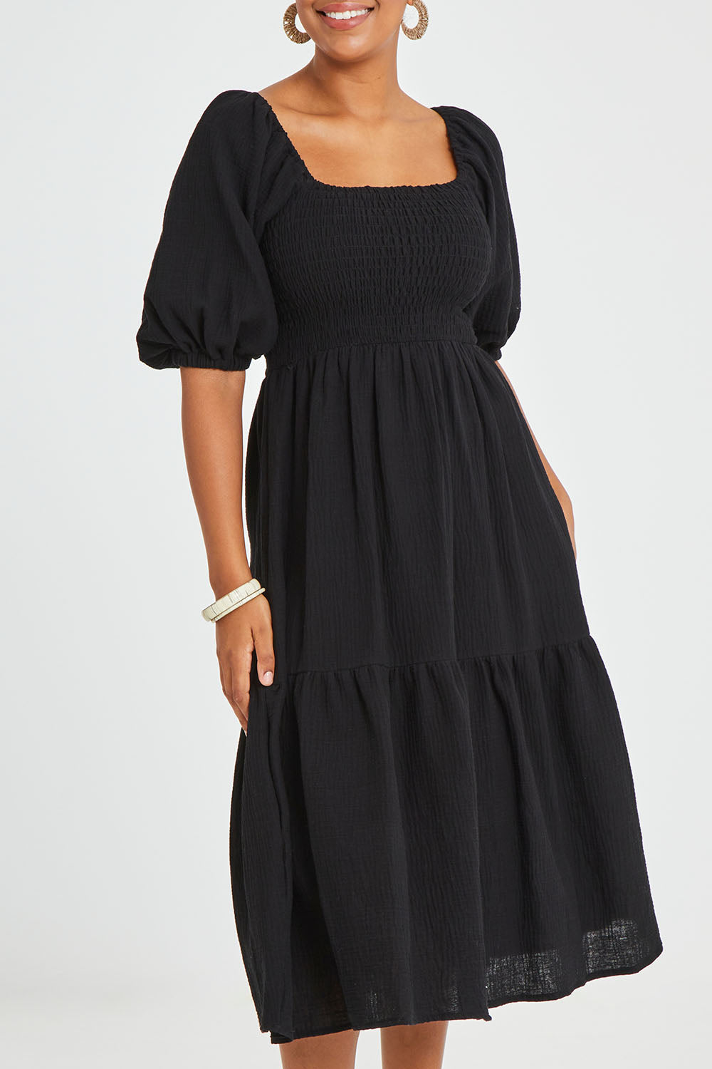 Model Noli wearing size 14 of the Wandering In Fields Organic Cotton Dress in colour Black (Black), from the front, cropped image
