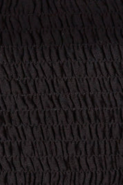 Product shot of the Wandering In Fields Organic Cotton Dress in colour Black (Black), detail