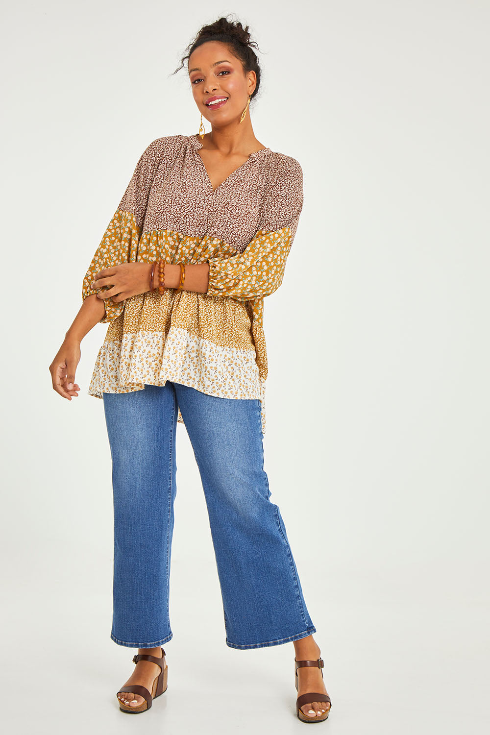 Model Noli wearing size 14 of the Cruising On By Tiered Blouse in colour Fleur, from the front, showing the whole outfit