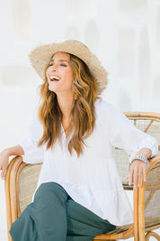 Model Ilona wearing size 10 of the Cruising On By Tiered Blouse in colour White (White), from the front, showing the whole outfit