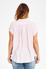 Model Laura wearing size 14 of the Go Your Own Way Button Blouse in colour Blush (Pink), from the back