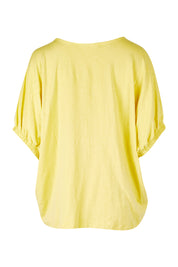 Product shot of the In My Arms Tee in colour Sunshine, from the back