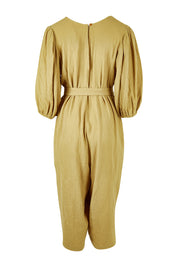 Product shot of the A Spring In My Step Jumpsuit in colour Olive (Green), from the back