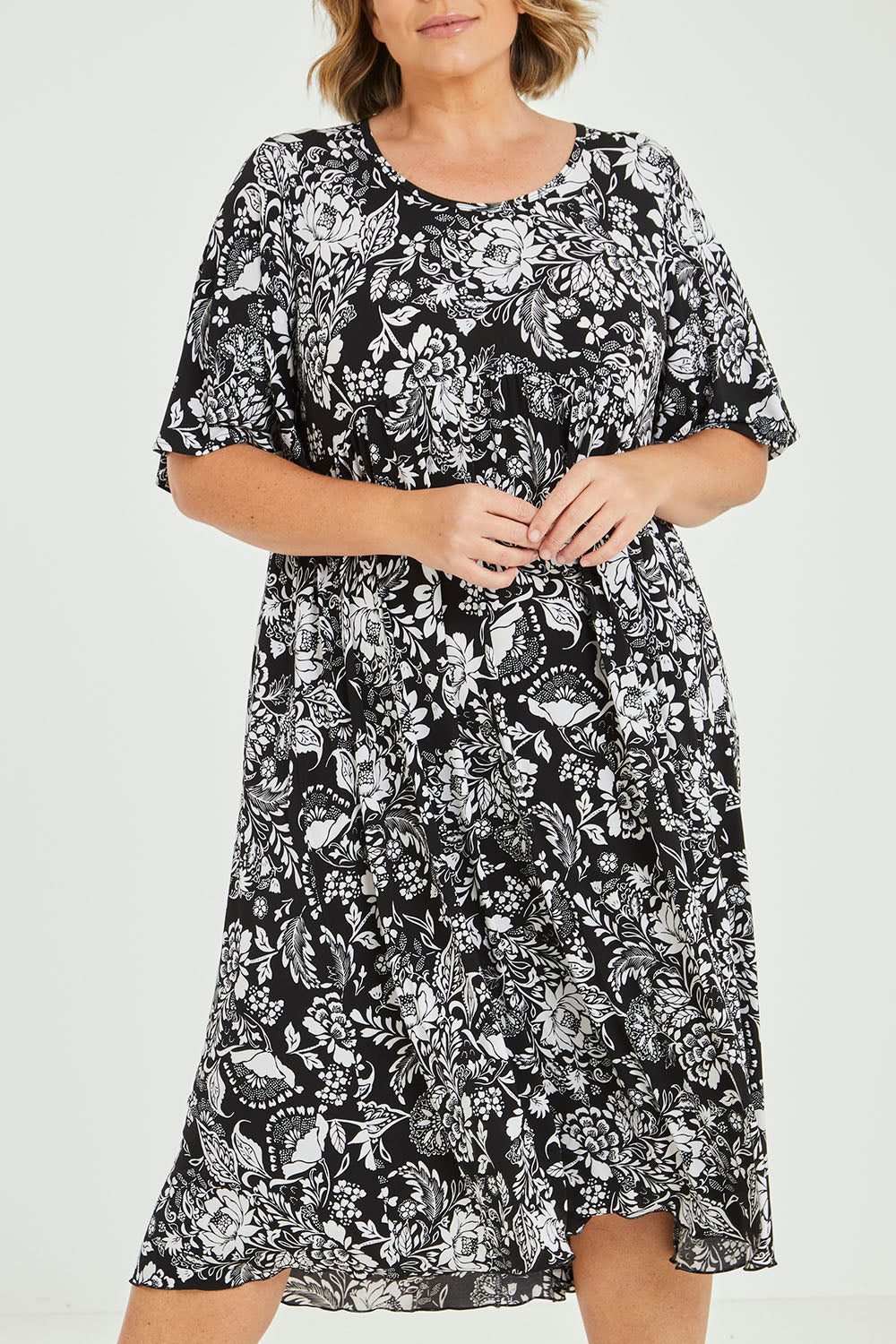 Model Fiona wearing size 16 of the Swinging Hands With You Dress in colour Blackfleur (Black), from the front, cropped image