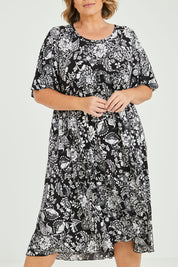 Model Fiona wearing size 16 of the Swinging Hands With You Dress in colour Blackfleur (Black), from the front, cropped image