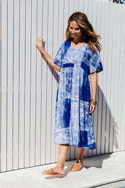 Model Ilona wearing size 10 of the Swinging Hands With You Dress in colour Ocean (Blue), from the front, showing the whole outfit