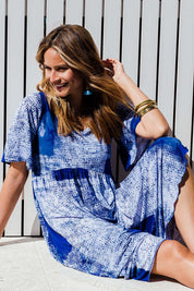 Model Ilona wearing size 10 of the Swinging Hands With You Dress in colour Ocean (Blue), from the front, showing the whole outfit