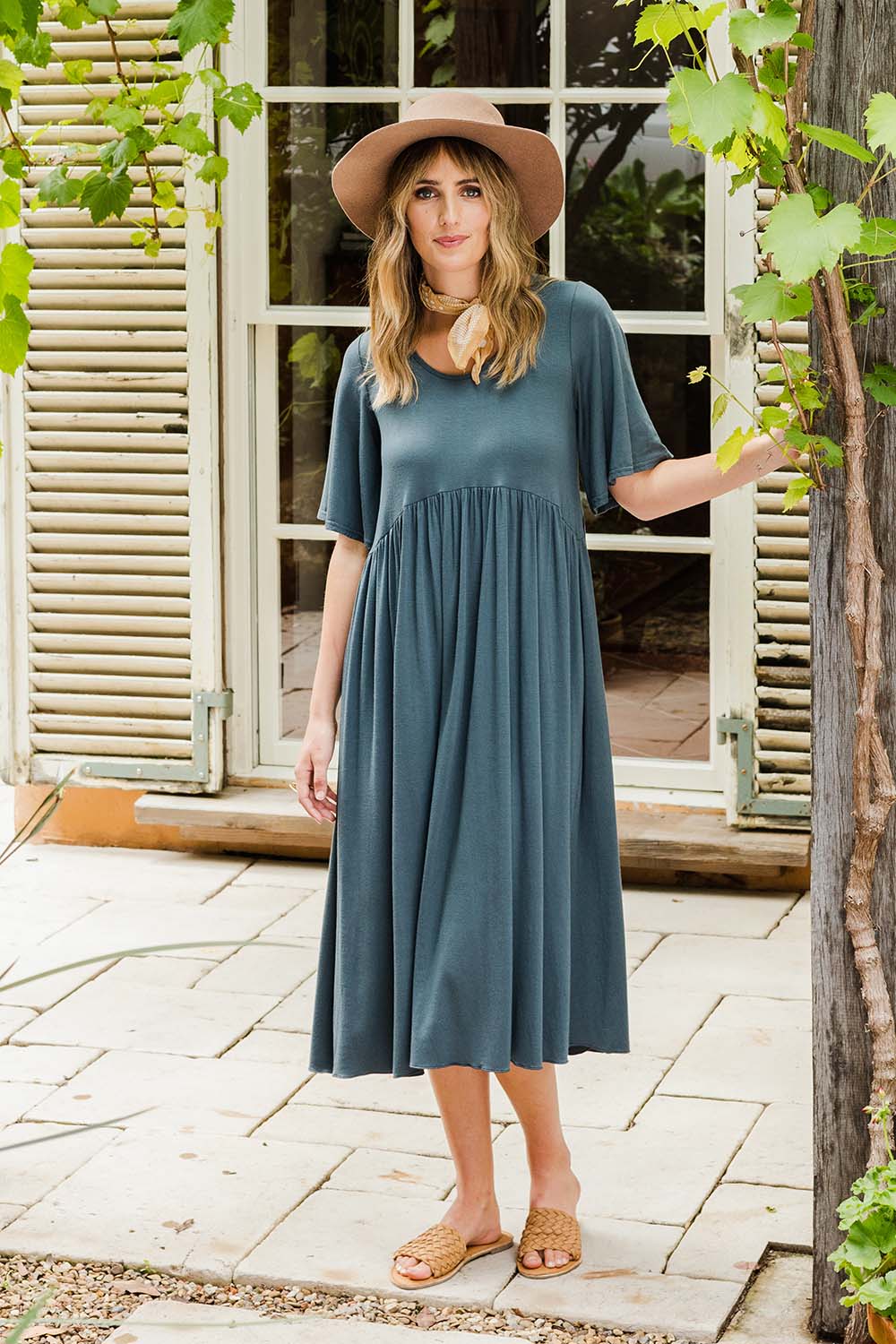 Model Tegan wearing size 10 of the Swinging Hands With You Dress in colour Army (Green), from the front, showing the whole outfit
