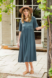Model Tegan wearing size 10 of the Swinging Hands With You Dress in colour Army (Green), from the front, showing the whole outfit