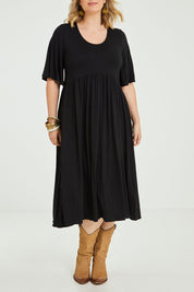 Model Jess wearing size 14 of the Swinging Hands With You Dress in colour Black (Black), from the front, cropped image