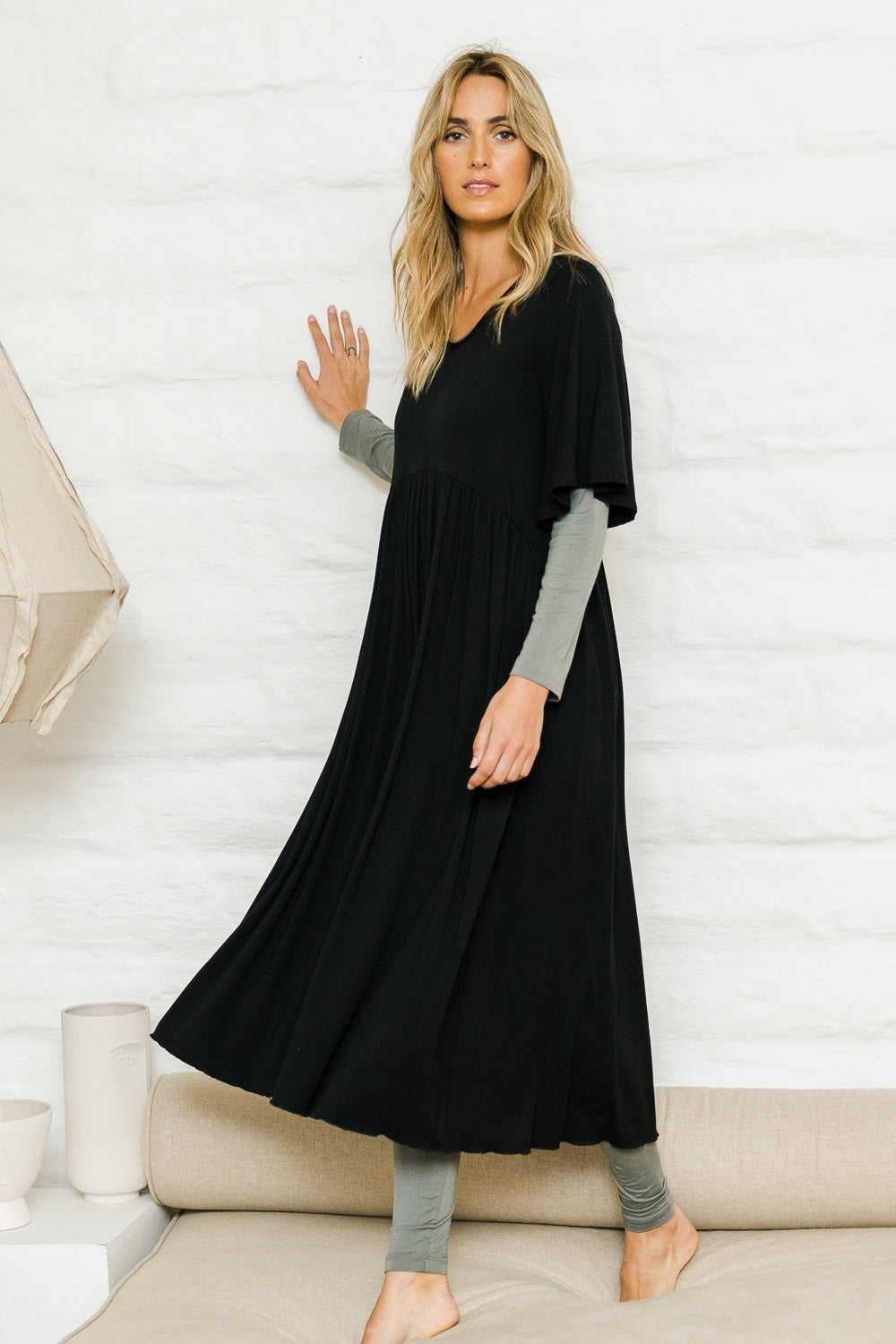 Model Tegan wearing size 10 of the Swinging Hands With You Dress in colour Black (Black), from the front, showing the whole outfit