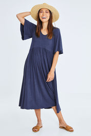 Model Cara wearing size 10 of the Swinging Hands With You Dress in colour Marldenim (Blue), from the front, showing the whole outfit