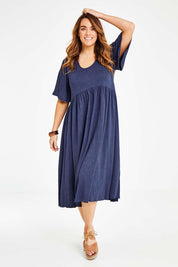 Model Laura wearing size 14 of the Swinging Hands With You Dress in colour Marldenim (Blue), from the front, showing the whole outfit