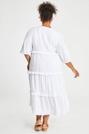 Model Alexis wearing size 16 of the Tiers Of Laughter Maxi Dress in colour White (White), from the back