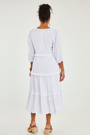 Model Noli wearing size 14 of the Tiers Of Laughter Maxi Dress in colour White (White), from the back