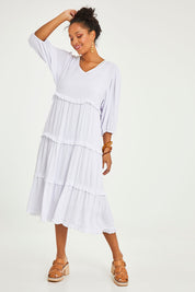 Model Noli wearing size 14 of the Tiers Of Laughter Maxi Dress in colour White (White), from the front, showing the whole outfit